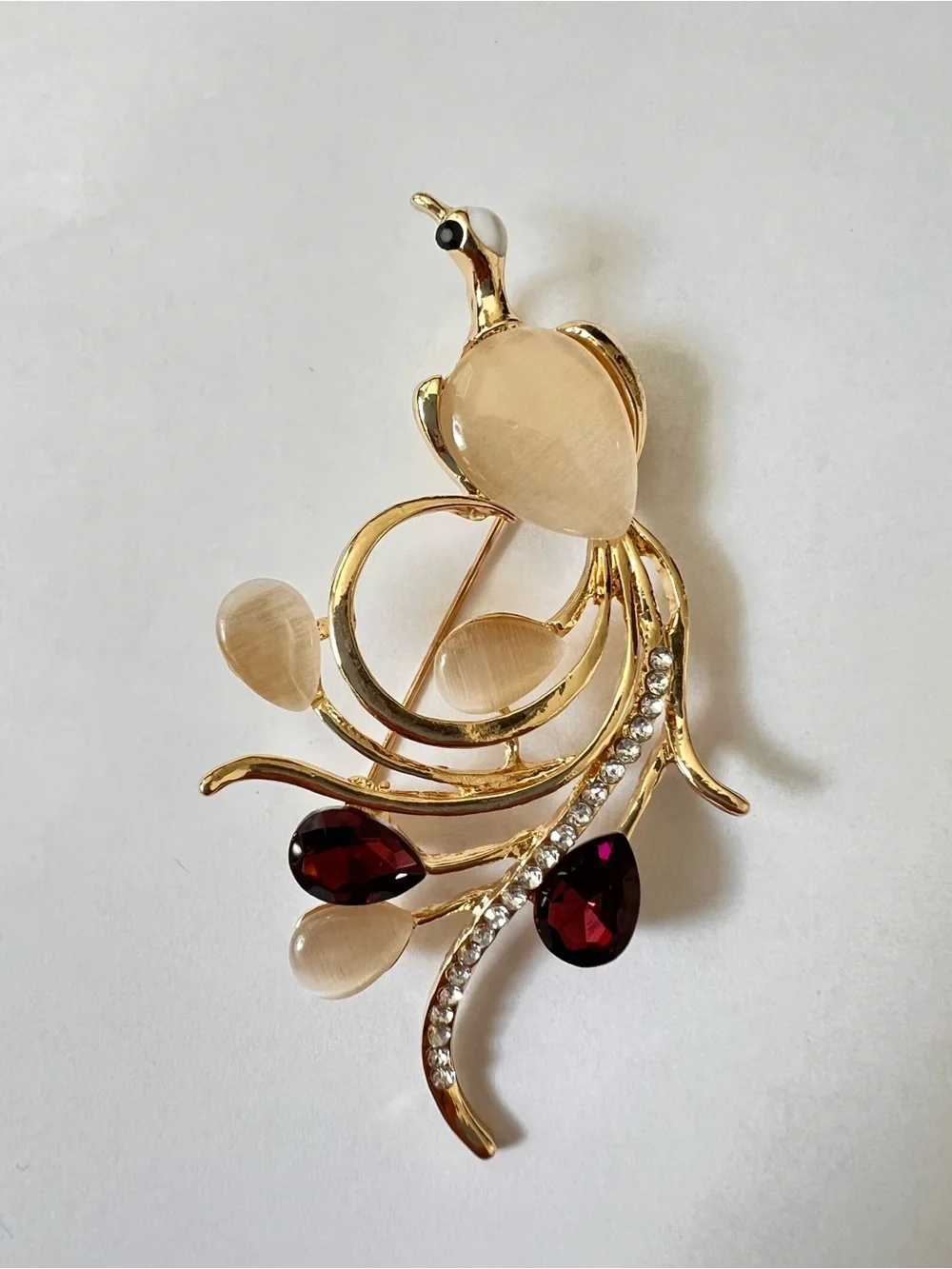 Gold-Tone Floral Bird Brooch with Champagne and Garnet Stones